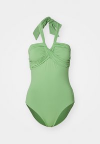 Maillot de bain une pièce vert en tissu lisse, avec un design torsadé au niveau du buste et des bretelles réglables à nouer aux épaules.