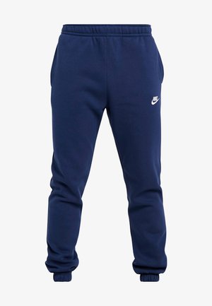 Calças de treino azul-marinho feitas de um tecido de mistura de algodão, com cintura elástica com cordão, punhos elásticos e um logótipo branco da Nike na coxa esquerda.