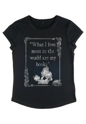 T-shirt noir avec un graphique gris représentant une fille lisant un livre avec une théière. Le texte indique : "Ce que j'aime le plus au monde, ce sont mes livres."