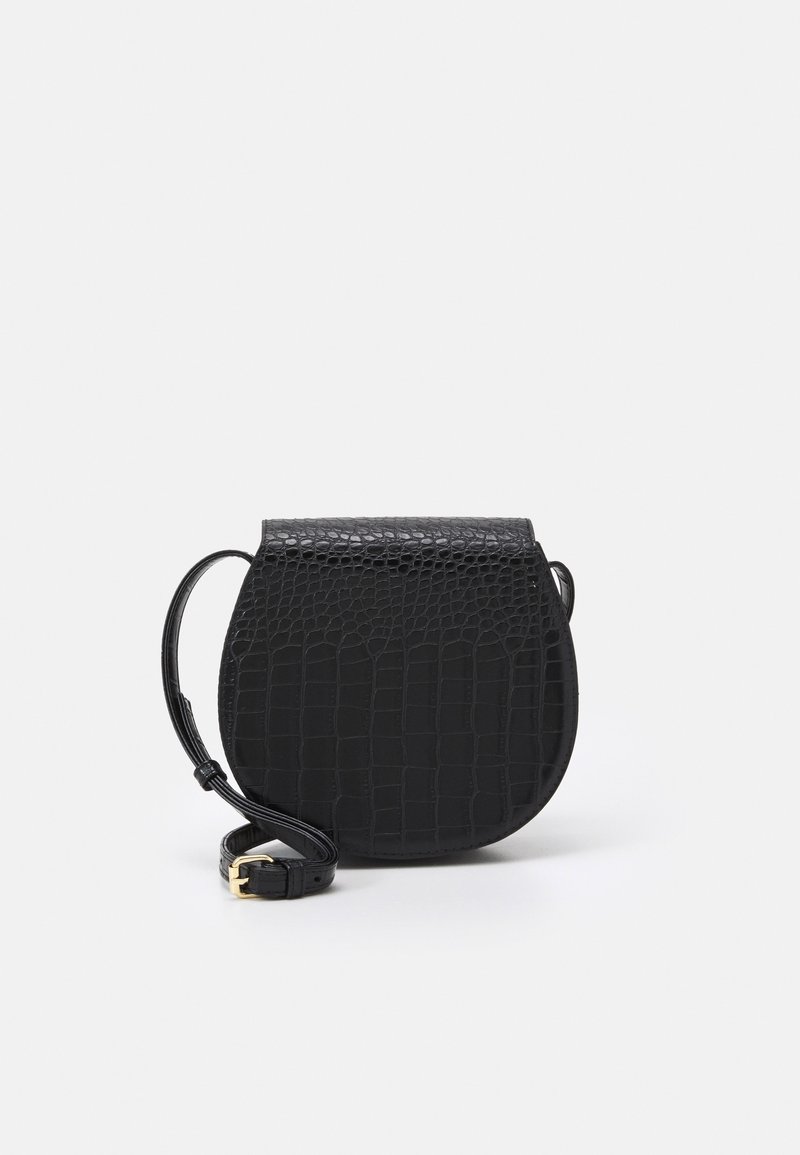 Black crossbody bag made of textured faux leather with a crocodile pattern. Rounded shape, top flap closure, and adjustable strap with gold hardware.