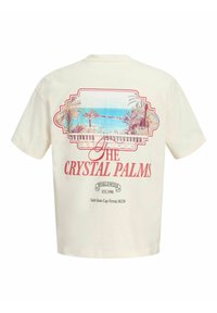 Μπεζ μπλουζάκι με vintage εκτύπωση από φοίνικες, θέα στον ωκεανό και κείμενο "THE CRYSTAL PALMS" και "Saint-Jean-Cap-Ferrat, 06230" στην πλάτη.