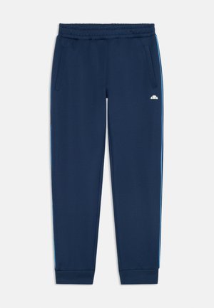 Pantalon de survêtement bleu marine avec taille élastique, poches latérales et rayures bleu clair sur l'extérieur. Tissu doux avec un design de jambe fuselée.