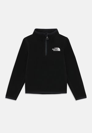 Pull en polaire noir à manches longues, col demi-zip et logo blanc sur le côté gauche de la poitrine. Texture douce et coupe régulière.