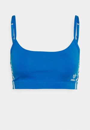 Blaue Sport-BH mit dünnen Trägern, aus glattem Stoff gefertigt. Verfügt über weiße Streifen an den Seiten und ein kleines Logo unten rechts.