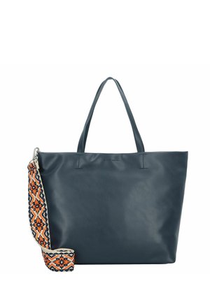 Sac en cuir marine avec deux courtes anses et une bandoulière amovible à motifs, présentant des designs géométriques en orange et crème.