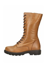 Tan leren veterschoenen met een ronde teen, een robuuste zool en metalen oogjes. Hoge schacht met een gladde textuur en minimale stiksels.