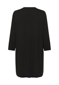 Tunique noire à manches longues avec un col rond et un ourlet droit, vue de dos sur un fond blanc.