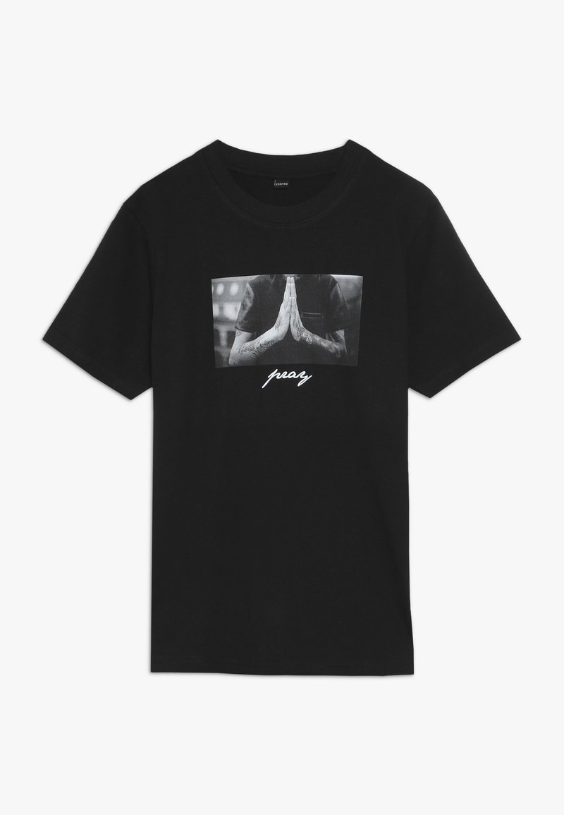 Black cotton t-shirt featuring a central graphic of hands in a praying position with the text "pray" below in a stylized white font.