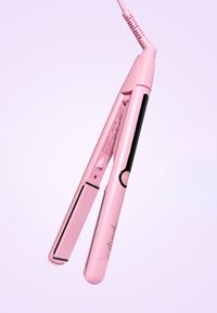 Roze haarstijl staal met een slank ontwerp, ronde hoeken en een gestructureerde grip. Heeft een zwart accent en een controleknop; kabel is bevestigd.