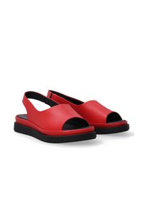 Red leather sandals with an open toe design, elastic slingback, and a black sole. Smooth texture with a modern, minimalist shape.