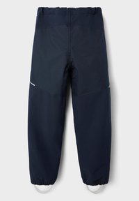 Navy wasserfeste Hose mit elastischem Bund, ausgestattet mit einer glatten Textur, verstärkten Abschnitten und reflektierenden Details am Unterschenkel.