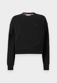 Svart cropped sweatshirt laget av mykt materiale med rund hals. Har lange ermer og en liten rød 'R'-logo på brystet.