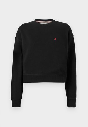 Musta lyhytCrop-sweatshirt, joka on valmistettu pehmeästä materiaalista ja jossa on pyöreä kaula-aukko. Varustettu pitkillä hihoilla ja pienellä punaisella 'R'-logolla rinnassa.