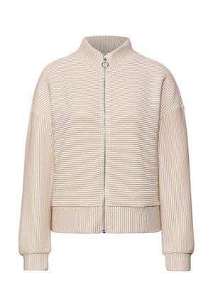 Béžová proužkovaná bunda s vysokým límcem, plným zipem a žebrovanými manžetami. Měkká textura s volným střihem. Vertikální proužky po celém povrchu.