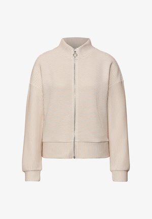 Béžová proužkovaná bunda s vysokým límcem, plným zipem a žebrovanými manžetami. Měkká textura s volným střihem. Vertikální proužky po celém povrchu.
