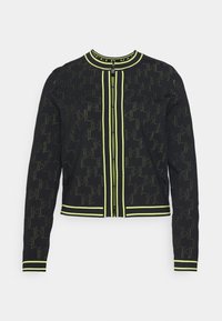 Czarna krótka kurtka w wzór pepitki, z neonowozielonymi lamówkami, zamkiem na całej długości oraz długimi rękawami. Tkanina o fakturze, z prążkowanymi mankietami.