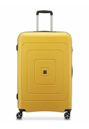 Yellow hard-shell suitcase with a textured, concentric design, retractable handle, and four wheels for mobility. Features a small logo.