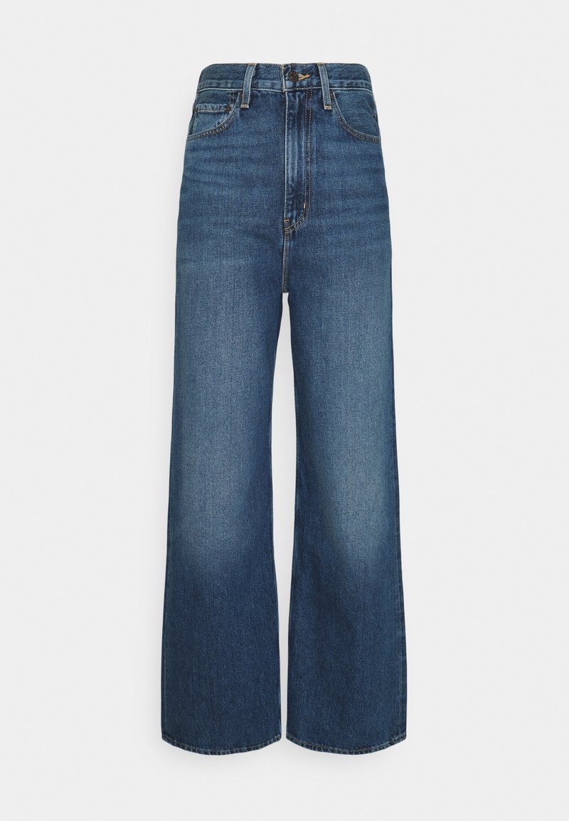 Jean en denim bleu taille haute, coupe large, bouton et fermeture éclair à l'avant, design classique à cinq poches.