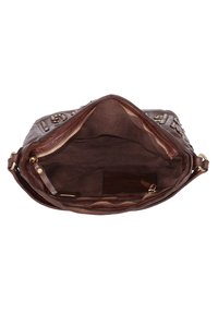 Borsa a mano in pelle marrone con un ampio interno, dotata di numerose tasche con zip e di una morbida fodera in tessuto. Accentuata da elementi in ottone.