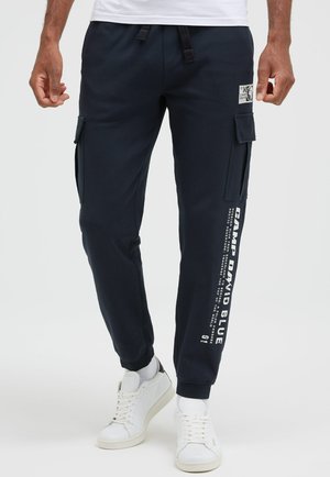 JOGGING MIT BEINTASCHEN UND PRINTS - Cargo trousers - blue navy