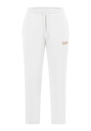 Hvide bomulds sweatpants med elastisk talje og justerbar snor. Har et lille beige logo på det øverste lår. Tætsiddende design.