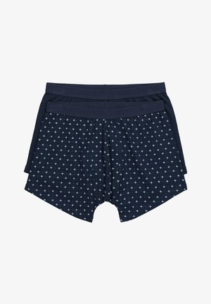 Dos pares de calzoncillos bóxer masculinos de color azul oscuro, uno liso y otro con un pequeño patrón de estrellas blancas, colocados planos sobre un fondo blanco.
