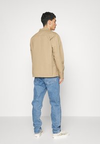 Weekday BARREL - Calças de ganga de corte afunilado - harper blue