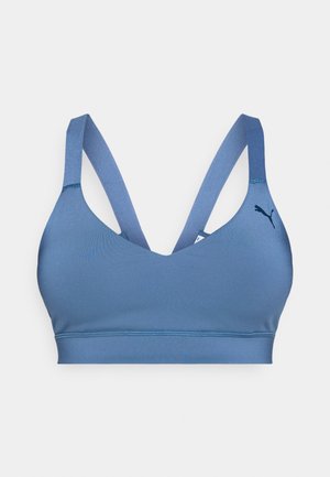 Blue sports bra with wide straps and a small Puma logo on the left side, designed for athletic support.