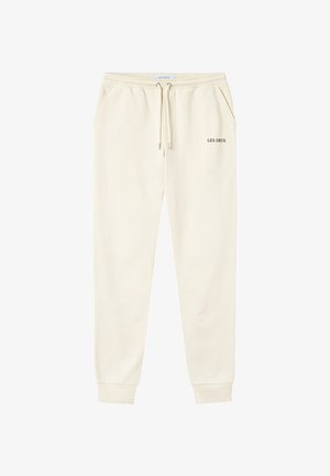 Crèmekleurige sweatpants met elastische tailleband, trekkoord, zijzakken, omgeslagen enkels en "LES DEUX" logo gedrukt op de rechterdij.
