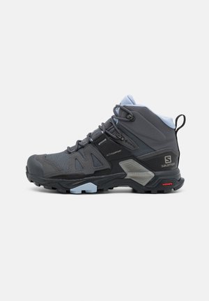 Grau Hiking-Stiefel aus synthetischen Materialien mit hohem Knöcheldesign, strukturiertem Obermaterial, gesichertem Schnürsystem und robustem Profil für Traktion.