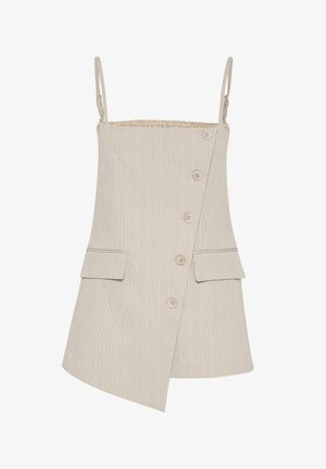 Beige klänning med tunna band, ett strukturerat rutmönster, knäppning fram och två fickor på höfterna, med en diagonalt fåll.