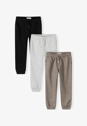 Tri páry detských bavlnených športových nohavíc v čiernej, svetlošedej a béžovej farbe s elastickým pásom a manžetami na členkoch.