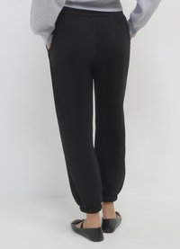 Calliope GINNICO UNITA - Pantalon de survêtement - ultrablack