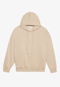 Beige zip-up hettegenser laget av mykt stoff, med en stor hette, frontlommer og snor detaljer. Enkelt og ukomplisert design.