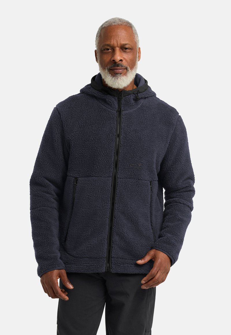 Giacca in pile di colore blu navy scuro, con chiusura con zip, cappuccio e due tasche frontali. Texture morbida con design a pannelli cuciti.