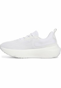 White athletic shoes featuring a textured mesh upper, thick ridged sole, and padded collar. Side logo embossed for branding.