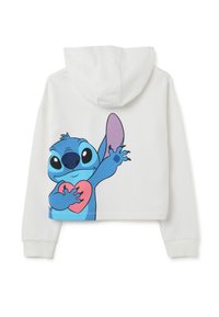 Sudadera corta blanca con un gran personaje de dibujos animados azul y un corazón rosa en la parte posterior. Tela suave, corte relajado, mangas largas con puños.