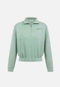 Ανοιχτό πράσινο μακρυμάνικο πουλόβερ με φερμουάρ στο στήθος, γιακά με μισό φερμουάρ  και ελαστική μέση, εμφανίζεται απλωμένο σε λευκό φόντο.