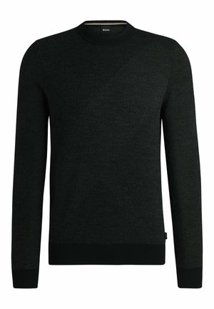 Maglione nero realizzato in tessuto a maglia testurizzata con scollatura a girocollo. Presenta motivi diagonali sul davanti e polsini e orlo a coste.
