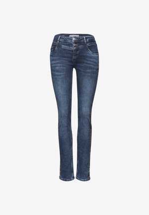 Chude dżinsy w ciemnoniebieskim kolorze, z średnim stanem, pięcioma kieszeniami i dekoracyjnym przeszyciem wzdłuż szwów bocznych.