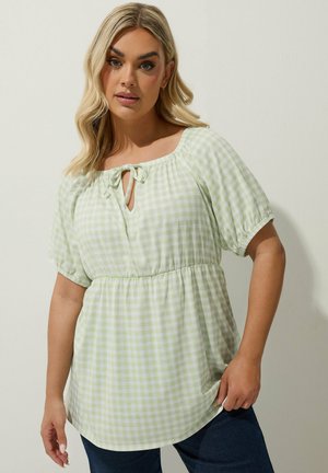Green and white gingham blouse with a scoop neckline, tie detail, short puff sleeves, and an elasticized waist; relaxed fit.