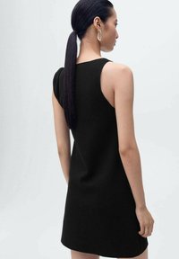 Black sleeveless dress with a fitted silhouette, made from smooth fabric. Features a rounded neckline and subtle shoulder detail.
