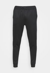 Svarta sweatpants tillverkade av mjukt tyg, med dragsko i midjan, tapered ben och cuffed anklar. Inga synliga mönster eller detaljer.