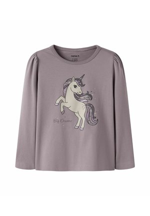Chemise lilas à manches longues pour tout-petit avec épaules bouffantes, représentant une licorne blanche cabrée à crinière violette avec le texte "Big Dreams" à l'avant.