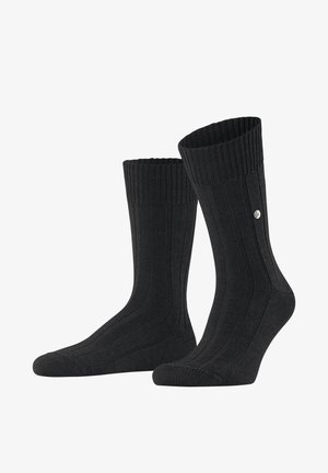 Schwarze gerippte Socken mit gepolsteter Sohle, hohem Design und verstärkter Zehenpartie. Enthält ein kleines Logo-Detail an der Seite.