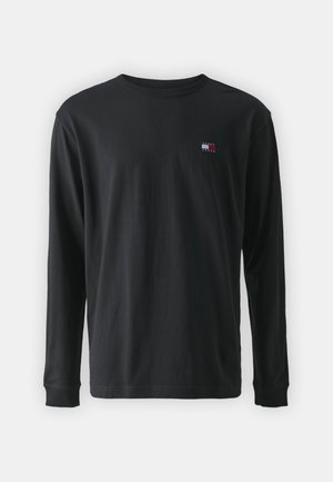 Long-sleeve black t-shirt made of cotton. Ribbed crew neck. Small multicolored logo on the left chest area. Soft, smooth texture.