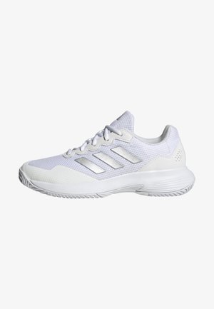 White athletic shoe with mesh upper, textured panels, and silver accents. Features a cushioned sole and round toe design.