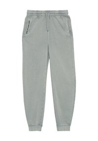 Zachte, lichtgrijze sweatpants met elastische tailleband en boorden. Heeft zijzakken en een bedrukt tekstdetail op de linkerzak.