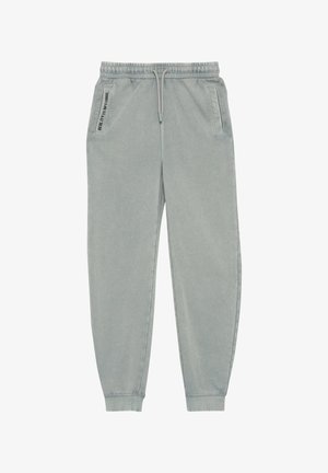 Weiche, hellgraue Sweatpants mit elastischem Bund und Bündchen. Verfügt über Seitentaschen und ein gedrucktes Textdetail auf der linken Tasche.