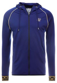 Marinblå zip-up huvtröja med guldpipning på axlarna, logotyp på bröstet, framfickor, dragsko och geometriskt mönster på ärmsluten.